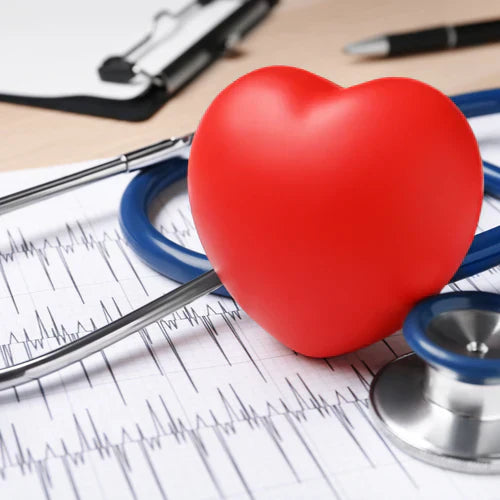 Red heart model and stethoscope on an ECG chart, representing innovative peptide therapies for heart health