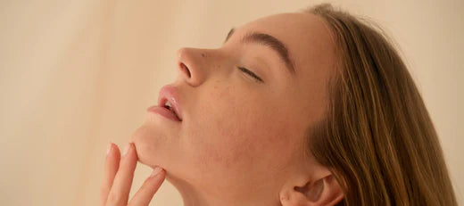 Close-up of a woman with clear skin, symbolizing the benefits of peptide solutions for better skin, health, and vitality