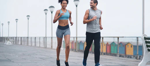 Man and woman jogging together, representing the benefits of peptides for muscle growth and recovery