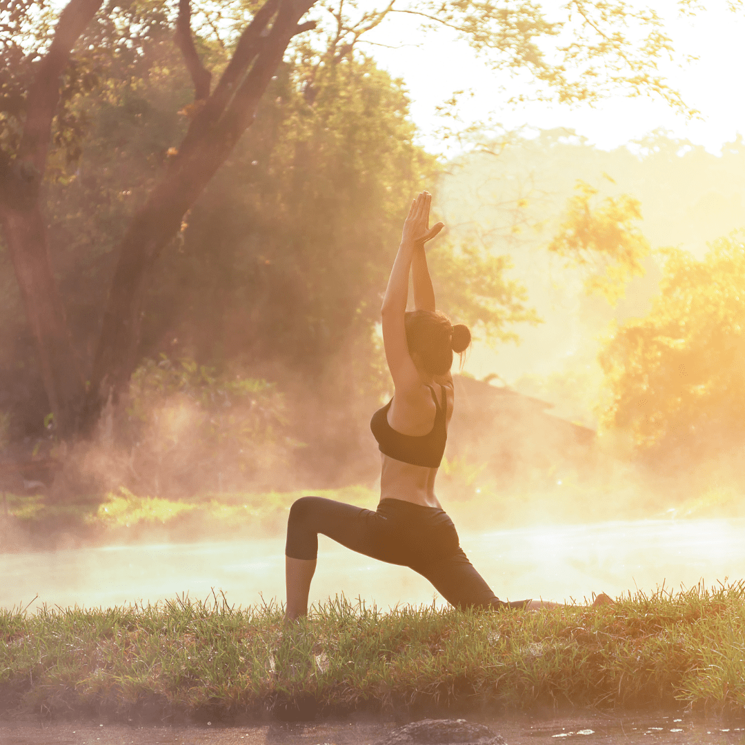 A person practicing yoga outdoors at sunrise, symbolizing the connection between science and vitality